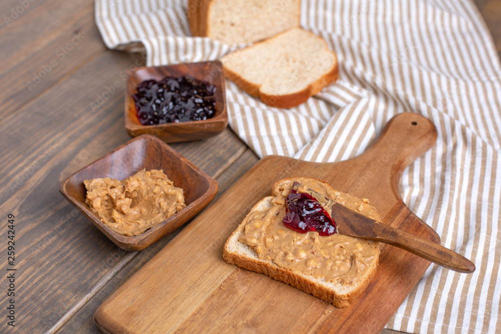 Peanut Butter, Grape Jelly, Loaf Bread Gathered to Make Sandwiches Peanut Butter, Grape Jelly, Loaf Bread Gathered to Make Sandwiches