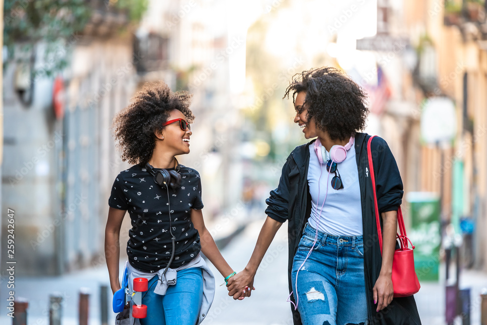 Obraz premium Mother Holding Hands to Her Daughter.