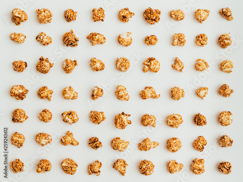 Popcorn kernels on white background photo