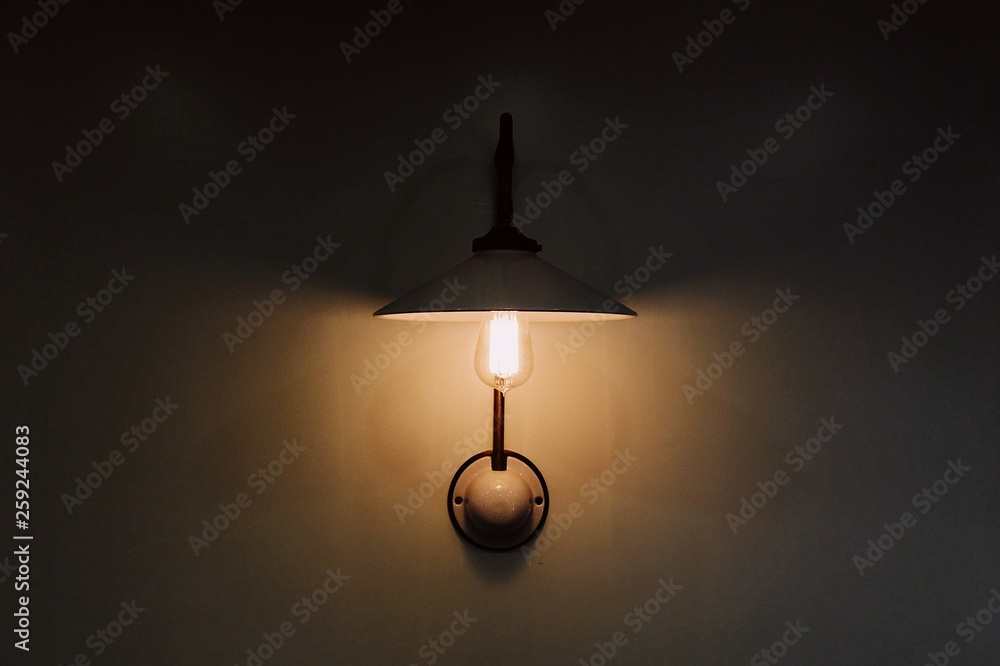 dim pendant lamp light hanging on an empty wall dim pendant lamp light hanging on an empty wall