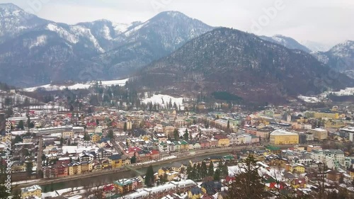 Enjoy the panorama of Bad Ischl from the top of Sirius Kogel mount, overlooking the town, Traun river, and snowy Alps on background, Salzkammergut, Austria. photo