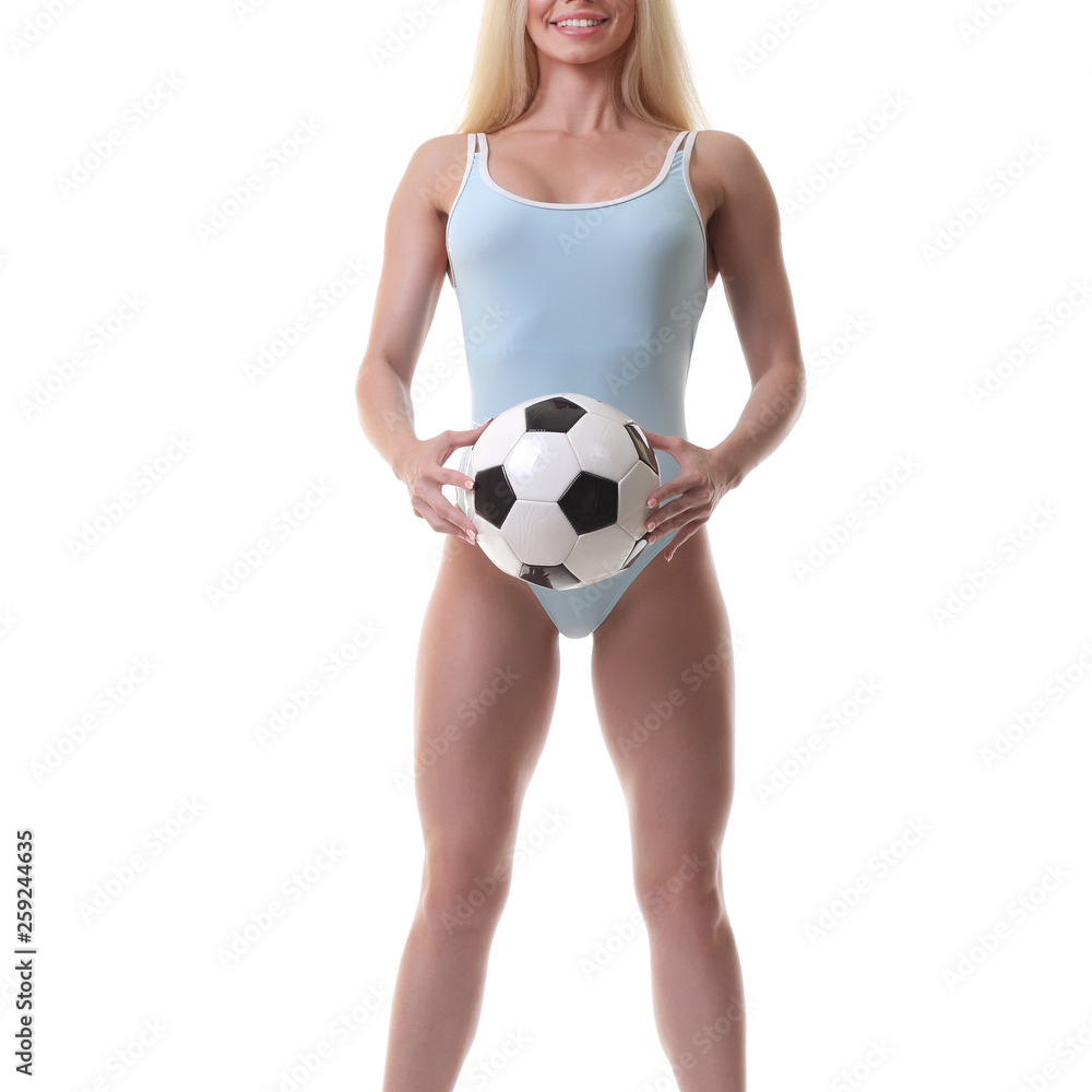young woman wearing bikini and holding soccer ball. young woman wearing bikini and holding soccer ball.