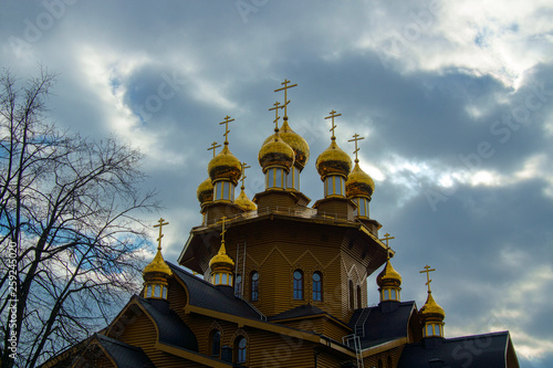 golden domes of a wooden christian temple