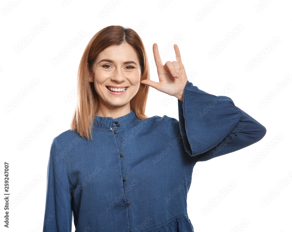 Woman showing I LOVE YOU gesture in sign language on white background Woman showing I LOVE YOU gesture in sign language on white background