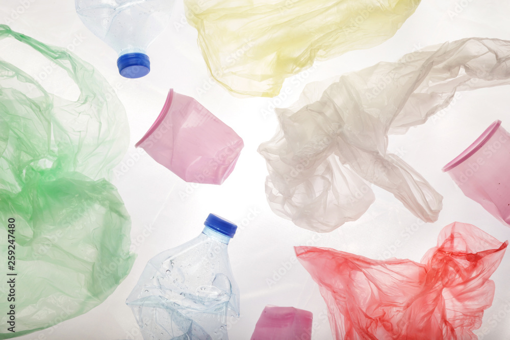 Single-use plastic waste, studio shot. Plastic pollution concept. Single-use plastic waste, studio shot. Plastic pollution concept.