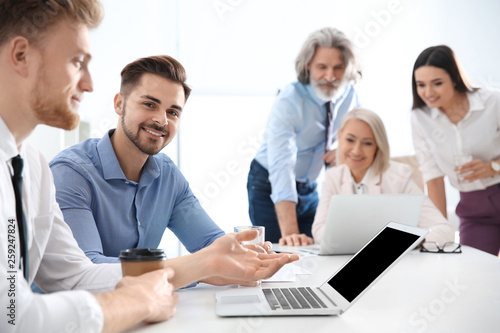 Business people discussing work matters in office. Professional communication
