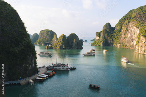 Tourist boats in the limestone towers of Ha Long bay