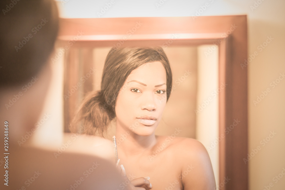 naked girl making up in front of the mirror in the bathroom naked girl making up in front of the mirror in the bathroom