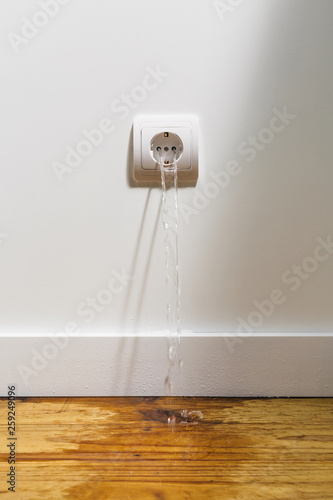 plug spitting water photo