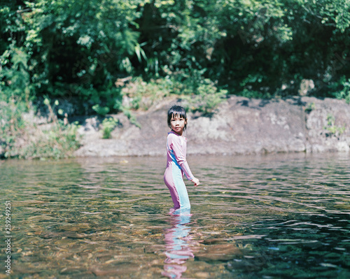 Asian little girl surprised expression in Natural lake.shot by 120 films photo