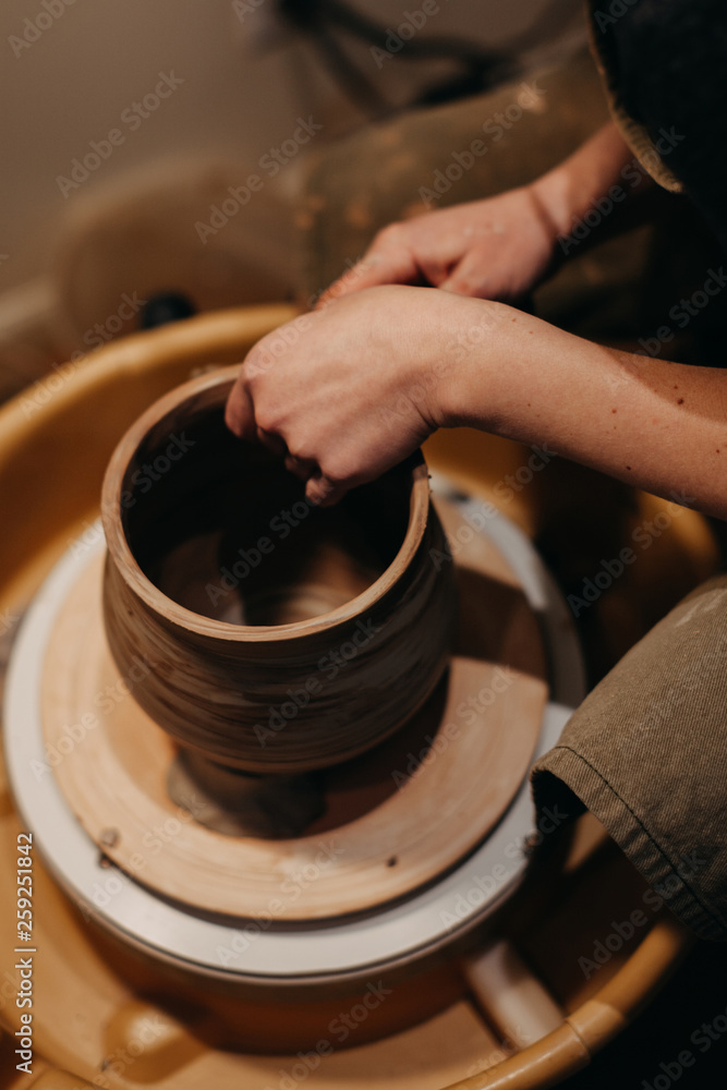 Potter Forming Vessel on Pottery Wheel Potter Forming Vessel on Pottery Wheel