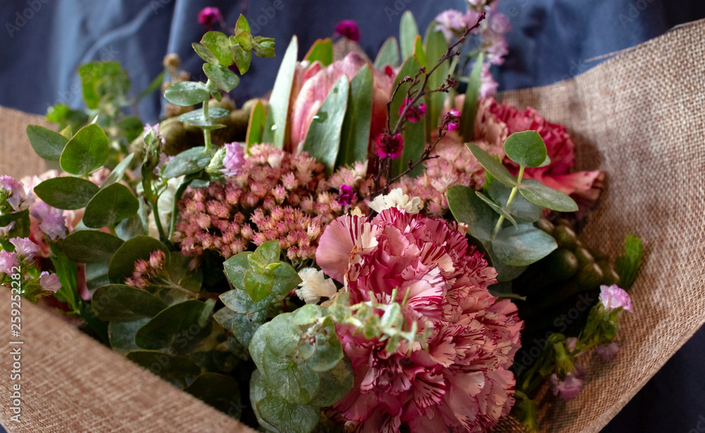 Beautiful Australian native flower arrangement wrapped bouquet Eucalyptus, protea, bush flowers, carnation close up Beautiful Australian native flower arrangement wrapped bouquet Eucalyptus, protea, bush flowers, carnation close up