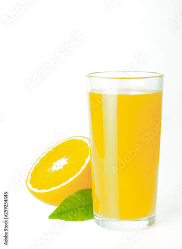 glass jar of fresh orange juice with fresh fruits on dark table