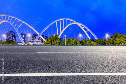 Empty asphalt road and bridge construction in shanghai at night