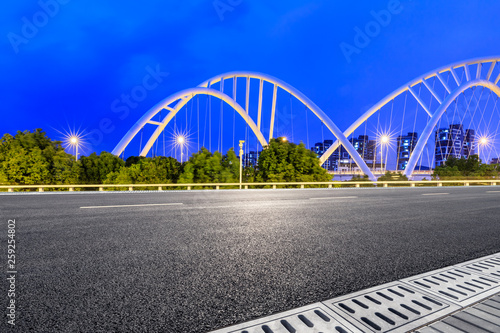 Empty asphalt road and bridge construction in shanghai at night