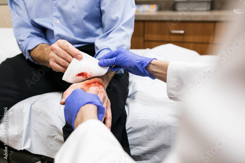Clinic: Man With Bad Cut On Hand Sees Doctor