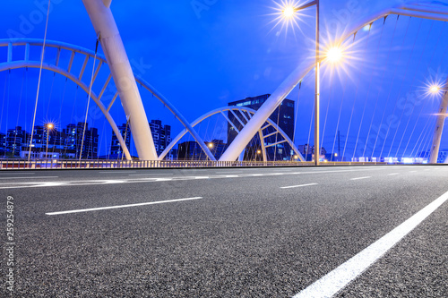 Empty asphalt road and bridge construction in shanghai at night © ABCDstock