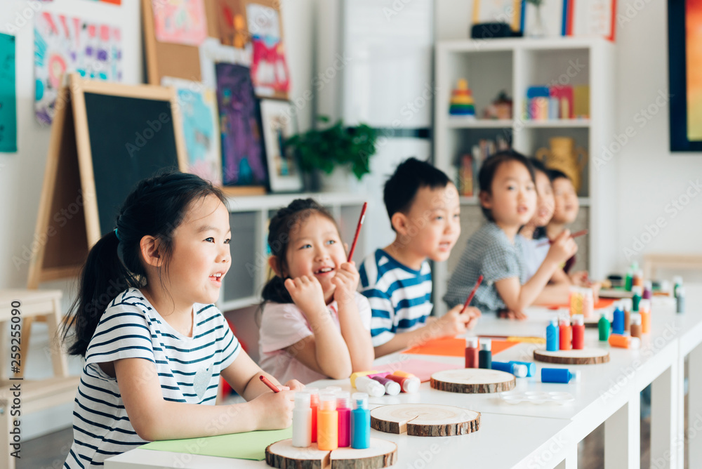 Preschool kids painting in classroom Preschool kids painting in classroom