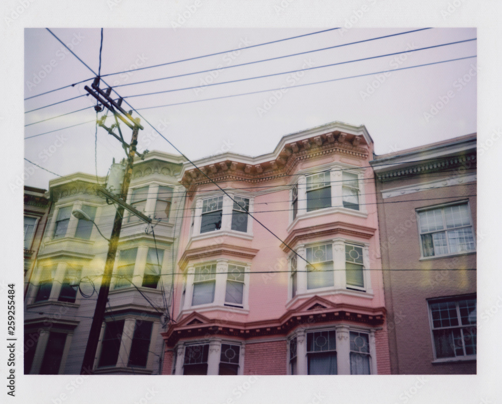 Polaroid (land camera) of pink and grey row houses in San Fransisco Polaroid (land camera) of pink and grey row houses in San Fransisco