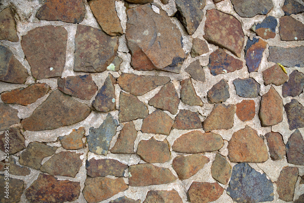 Random pattern stone wall at Halloran's Hill Lookout Park near Atherton in Tropical North Queensland, Australia Random pattern stone wall at Halloran's Hill Lookout Park near Atherton in Tropical North Queensland, Australia