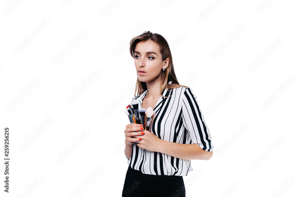 makeup artist girl on a white background with brushes makeup artist girl on a white background with brushes