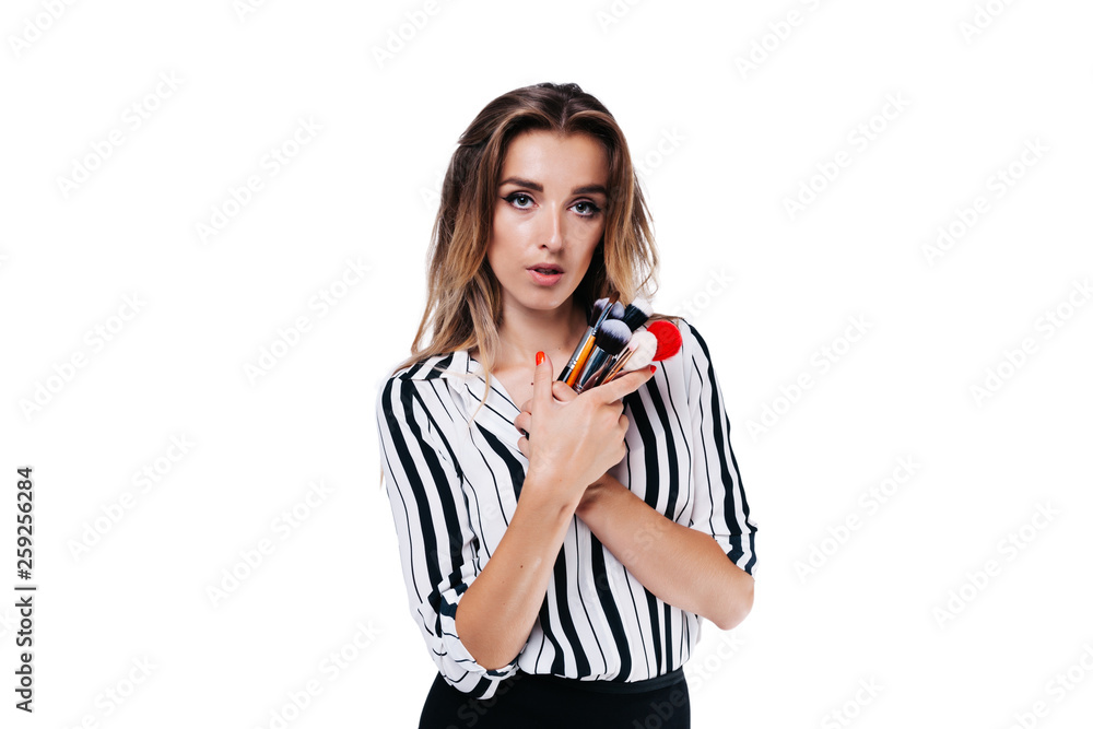 makeup artist girl on a white background with brushes makeup artist girl on a white background with brushes