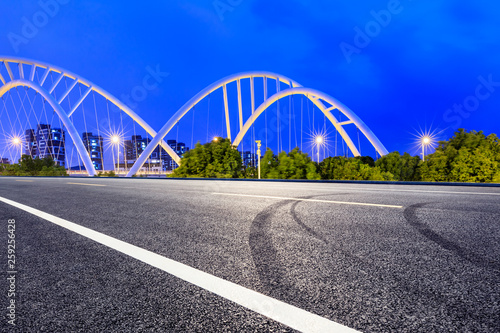 Empty asphalt road and bridge construction in shanghai at night © ABCDstock