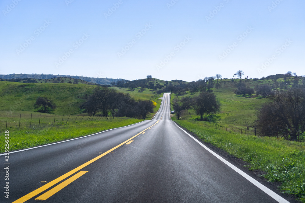 Driving through the countryside on a sunny spring day,