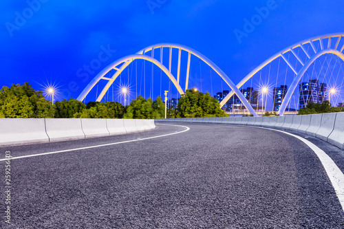 Empty asphalt road and bridge construction in shanghai at night