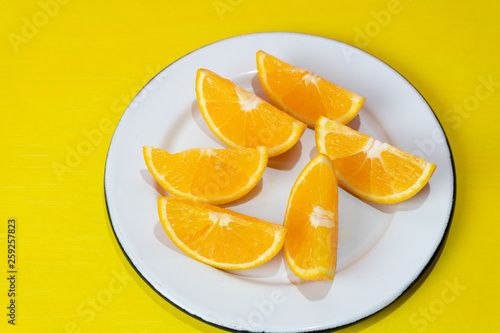 Orange slices on colorful background