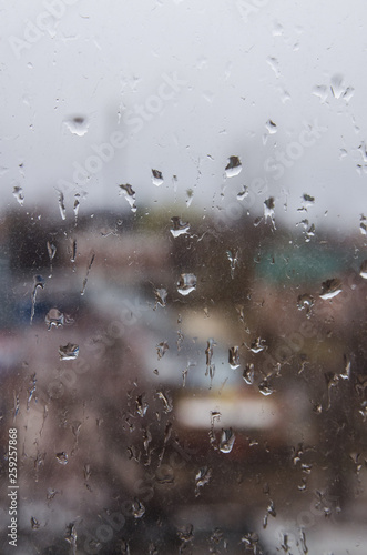 view on the street through the rainy window © Valeriysurujiu