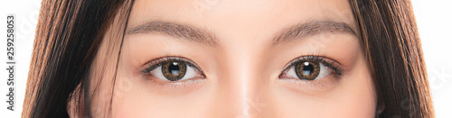Close-up Asian Women's eyes on White Blackground.