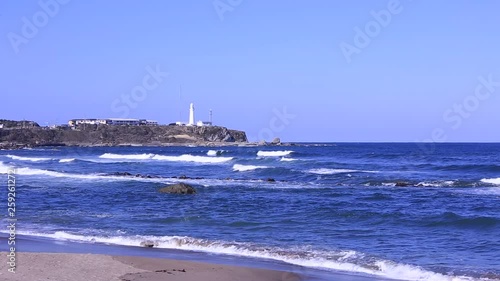 A distant lighthouse photo