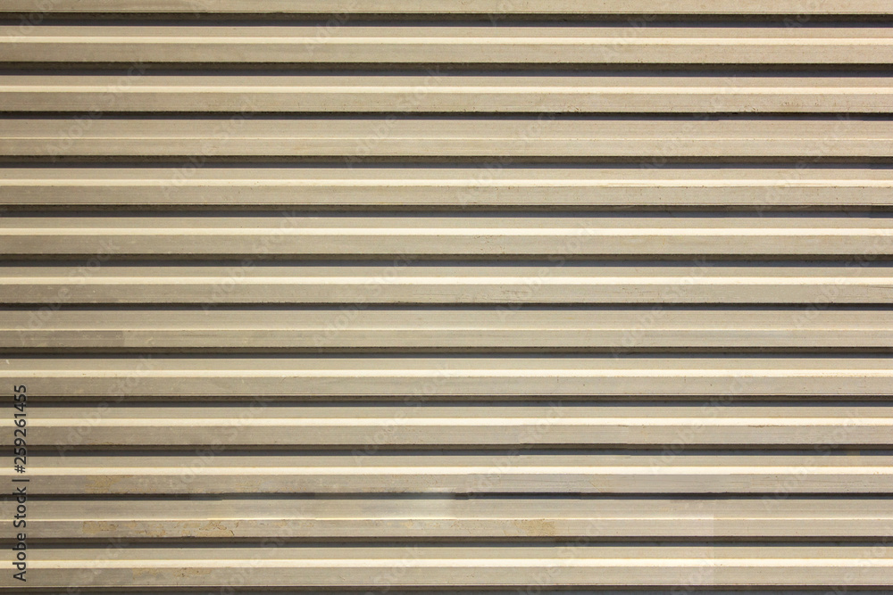 white gray yellow old dirty wall with horizontal lines and shadows. rough surface texture white gray yellow old dirty wall with horizontal lines and shadows. rough surface texture