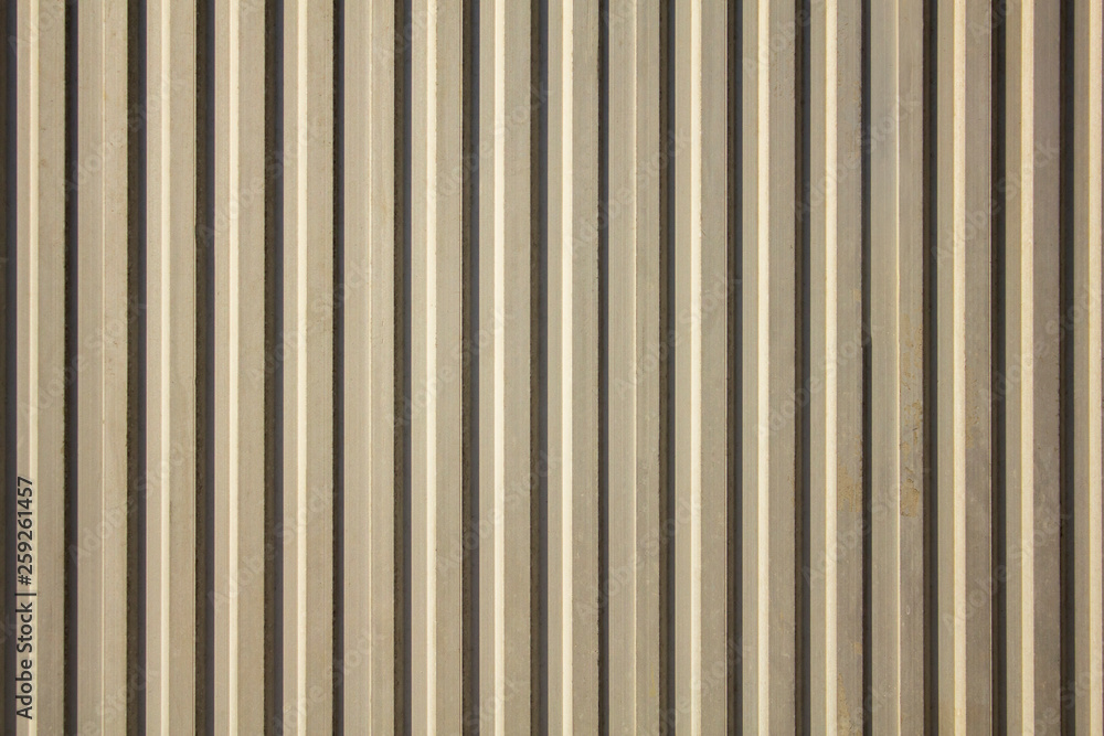 white gray yellow old dirty wall with vertical lines and shadows. rough surface texture white gray yellow old dirty wall with vertical lines and shadows. rough surface texture