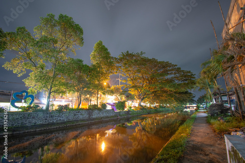 River on the edge of town Night photo Location of poor East Java Indonesia photo