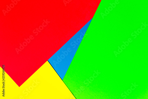 Vibrant multicolor background from cardboard of different colors. Color paper for background. Colorful abstract geometric shapes. Minimalist design for minimal background. Colorful background.