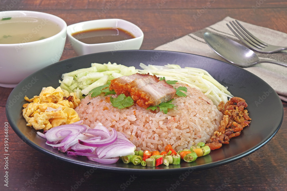 Fried rice with shrimp paste (Khao khluk Kapi) is a flavorful dish in Thai cuisine that consists of primary ingredients of fried rice mixed with shrimp paste (Kapi), typically served as a lunch dish.