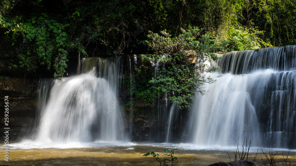 Fototapeta premium Beautiful waterfall in natural 'Si Dit Waterfall' with blue sky in khao kho national park 