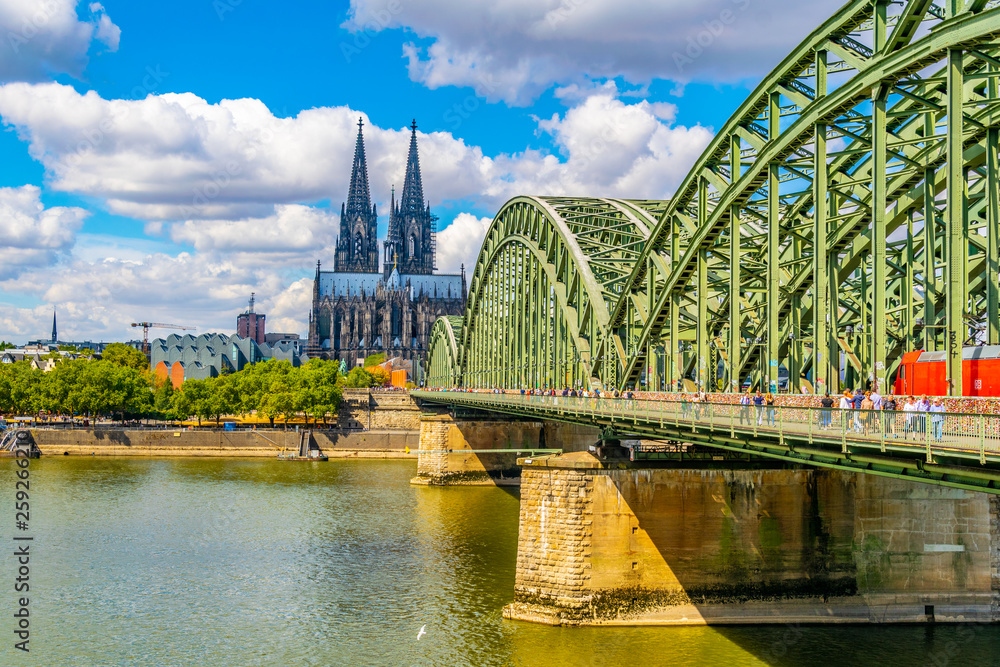 Fototapeta Cathedral in Cologne and Hohenzollern bridge over Rhein, Germany