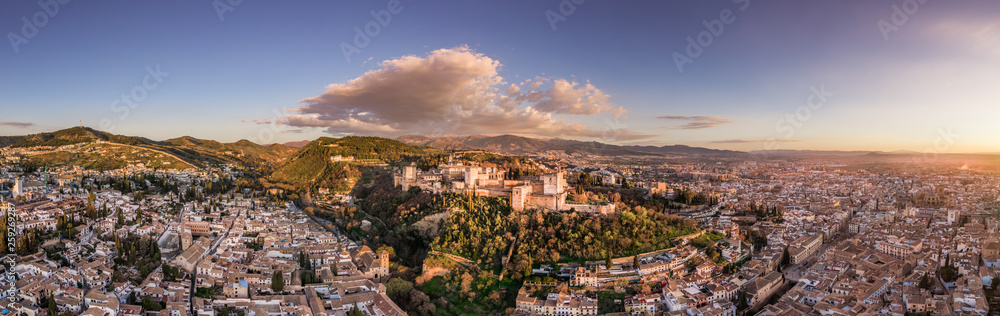 Granada Alhambra medieval palace castle at sunset aerial view