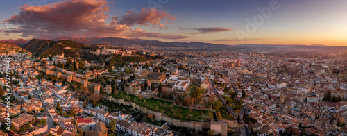 Granada Alhambra medieval palace castle at sunset aerial view