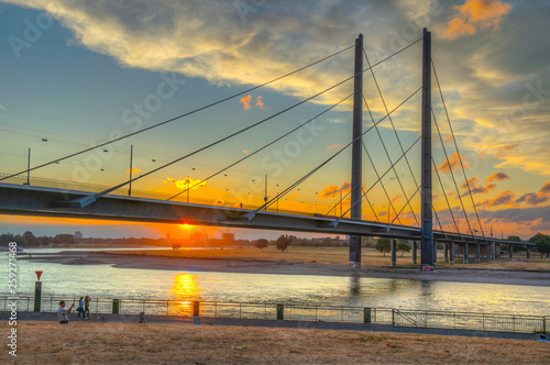 Sunset view of Rheinkniebrucke bridge in Dusseldorf, Germany photo