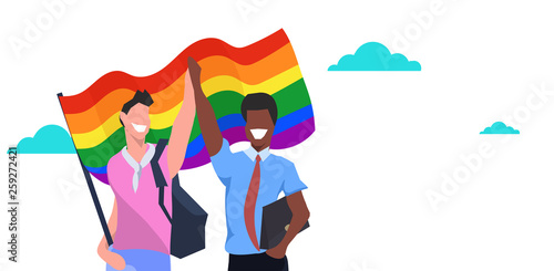 mix race couple gays holding lgbt rainbow flag love parade pride festival concept two smiling guys standing together male cartoon characters portrait horizontal flat