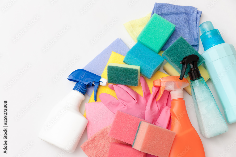 Cleaning equipment on light background. Bottles with detergent and cleaning tools. Colorful cleaning products. Washing, cleaning concept. Cleaning equipment on light background. Bottles with detergent and cleaning tools. Colorful cleaning products. Washing, cleaning concept.