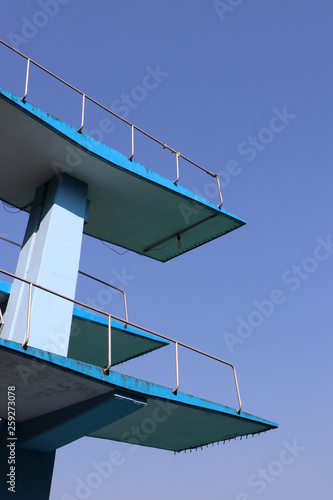 Two layer of jumping platform of swimming pool with blue sky.