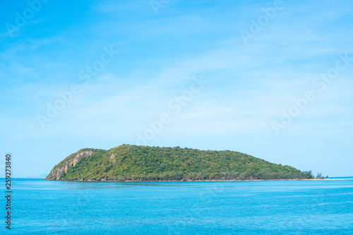 The island in the sea with blue sky background.