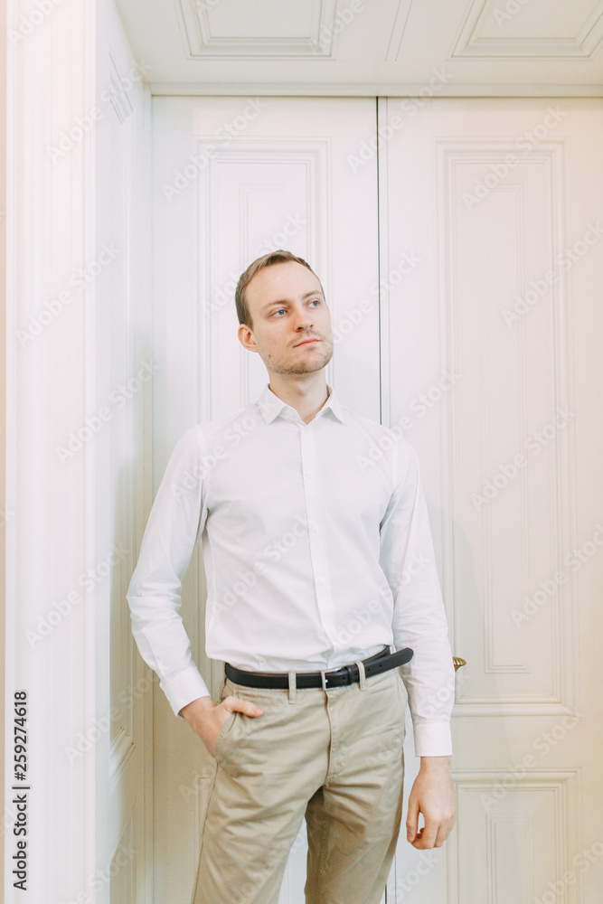 Portrait of a man in the European style. The preparations of the groom before the ceremony. Portrait of a man in the European style. The preparations of the groom before the ceremony.