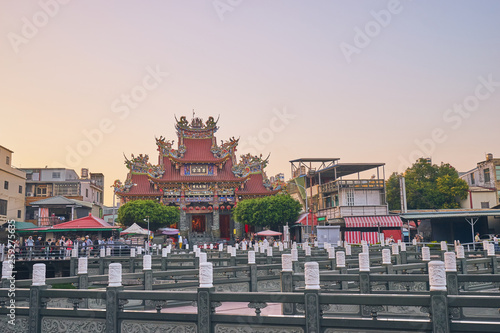 Kaohsiung, Taiwan - December 3, 2018: People come to merit at Cih Ji palace or Bao Sheng Da Di temple in sunset time at Zuoying district, Kaohsiung city, Taiwan.