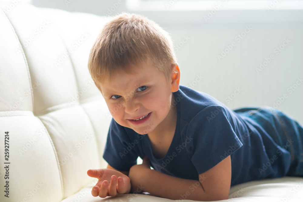 Portrait of hysterical boy. Upset caucasian kid crying at home. Portrait of hysterical boy. Upset caucasian kid crying at home.